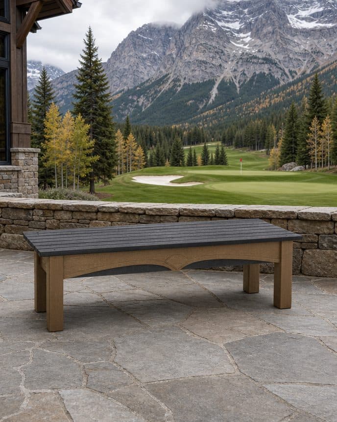 A tee box, marker and bench in frame